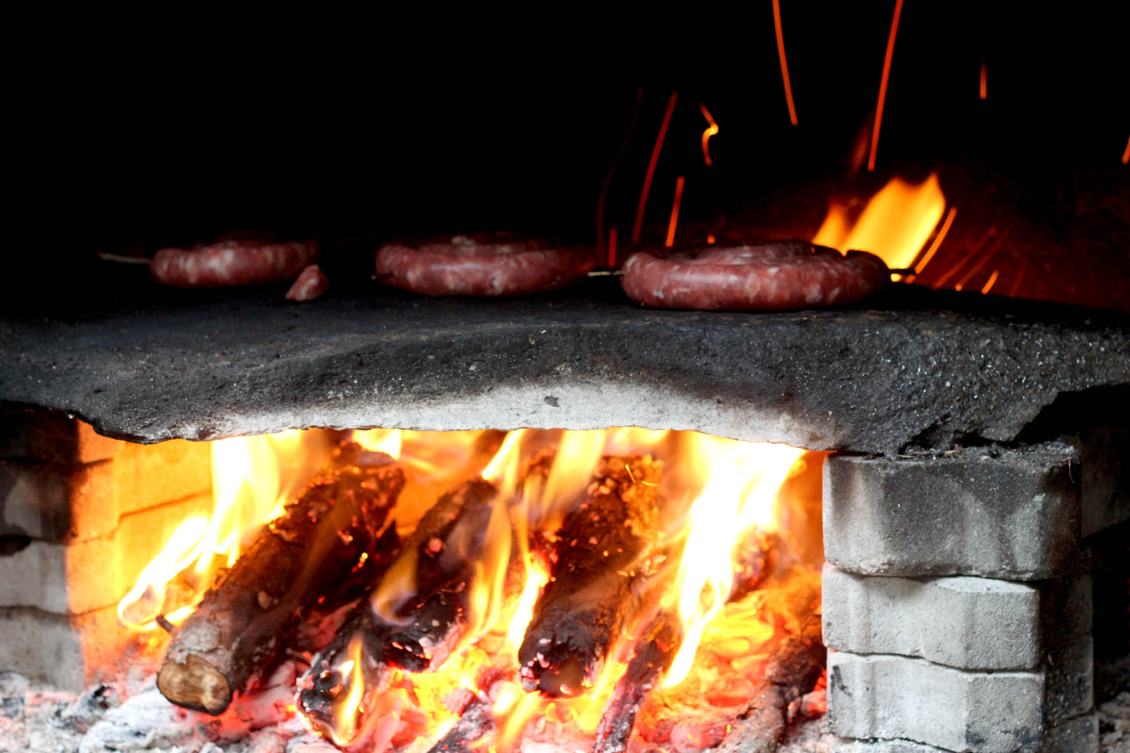 sausages in the fire Log Cabin Cooking