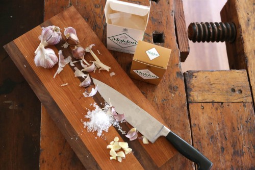 chop garlic with salt